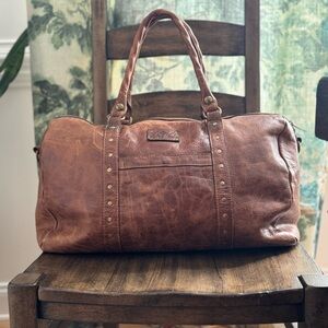 Patricia Nash Milano
Weekender Duffle Bag in brown leather.